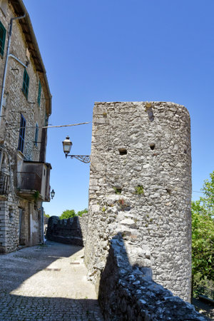 Bassiano, Italy, 05/10/2021. A narrow street between the stone buildings of a medieval town in the Lazio region.のeditorial素材