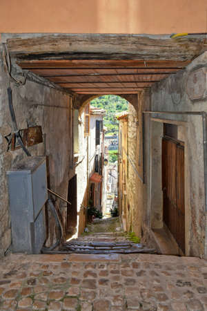 Sonnino, Italy, 05/10 / 2021. A street between old medieval stone buildings of a historic town in Lazio region, Italy.のeditorial素材