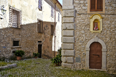 Sonnino, Italy, 05/10 / 2021. A street between old medieval stone buildings of a historic town in Lazio region, Italy.のeditorial素材
