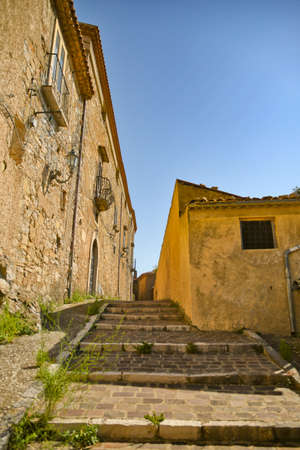 San Fele, Italy, 06/12/2021. A small street between the old houses of a medieval village in the Basilicata region.のeditorial素材