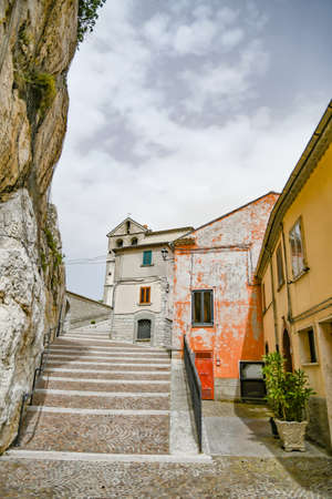 Pietrabbondante, Italy, 06/21/2021. A small street between the old houses of a medieval village in the mountains of the Molise region.の写真素材