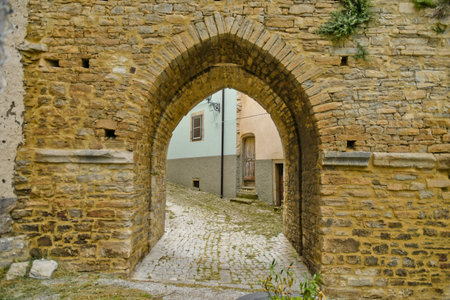 Agnone, Italy, 06/21/2021. A small street between the old houses of a medieval village del Molise region.のeditorial素材
