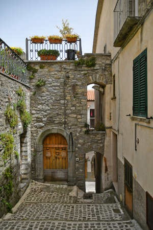 Poggio del Sannio, Italy, June 21, 2021. A small street between the old houses of Belmonte del Sannnio, a medieval village in the Molise region.のeditorial素材