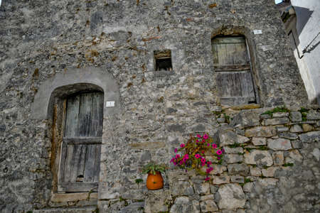 The wooden door of an old house in Carpinone, a medieval village in the Molise regionの写真素材