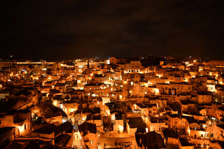 Night view of Matera, an ancient city built into the rock. It is located in the Basilicata regionの写真素材