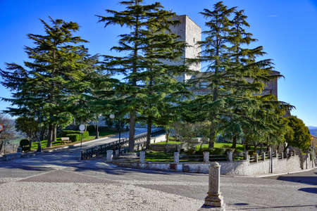 A square overlooking a medieval tower from the Norman era in Casalbore, an Italian village in the...