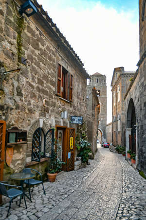 Caserta, Italy, 02/23/2022. A narrow street among the old stone houses of the oldest district of the...