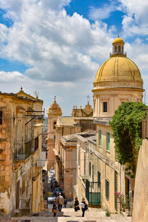 Noto, Italy, 06/02/2019. A street overlooking the dome of the cathedral in the old town.のeditorial素材
