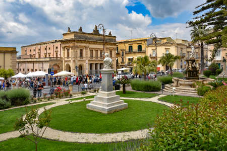 Noto, Italy, 06/02/2019. People in a square of a Sicilian city.のeditorial素材