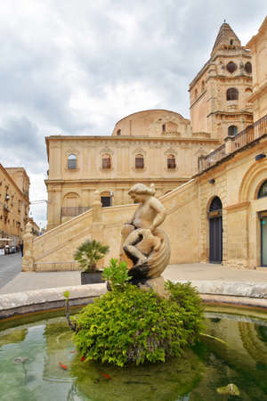 Noto, Italy, 06/02/2019. A fountain in a town pizza near the cathedral.のeditorial素材
