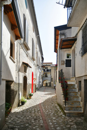 A narrow street between the old houses of Petina, a village in the mountains of Salerno province.の写真素材
