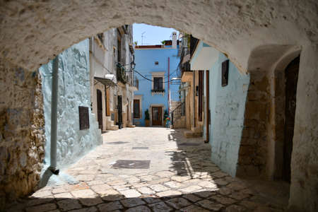 A small street in Casamassima, a village with blue-colored houses in the Puglia region of Italy.の写真素材