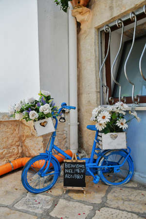A small street in Casamassima, a village with blue-colored houses in the Puglia region of Italy.の写真素材