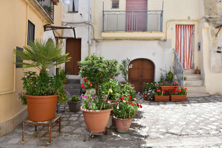 A narrow street among the old houses of Irsina in Basilicata, region of southern Italy.の写真素材