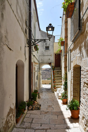 A narrow street among the old houses of Irsina in Basilicata, region of southern Italy.の写真素材