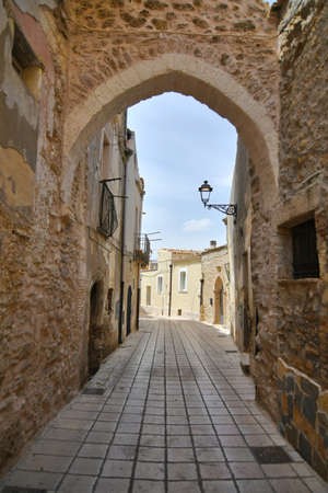 A narrow street among the old houses of Irsina in Basilicata, region of southern Italy.の写真素材