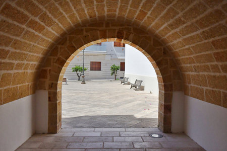 A street in the historic center of Specchia, a medieval town in the Puglia region, Italy.の写真素材