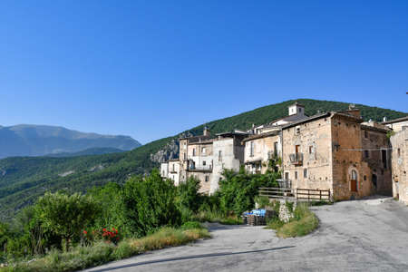 A narrow street between the old stone houses of Cansano, a medieval village in the Abruzzo region.の写真素材