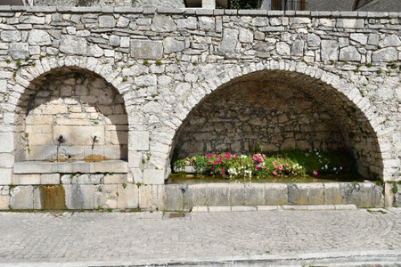 A public fountain in a street of Barrea, a medieval village in the Abruzzo region of Italy.の写真素材
