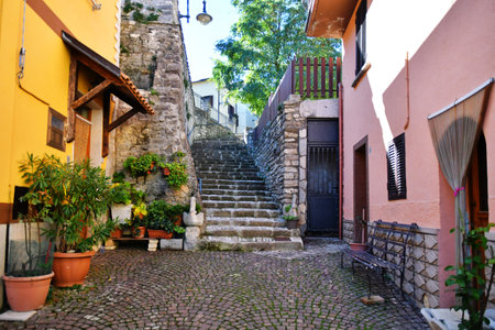 A narrow street between the old stone houses of Frosolone, a medieval village in the Molise region.の写真素材