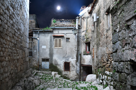 Night photo of a narrow street in Pietramelara, a medieval village in Caserta province, Italy.の写真素材