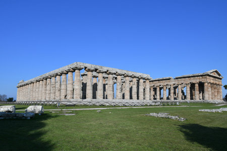 The columns of an ancient Greek temple in the archaeological park of Paestum in Campania.のeditorial素材