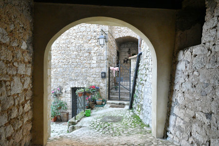 A narrow street among the old houses of Fumone, a historic town in the state of Lazio.の写真素材