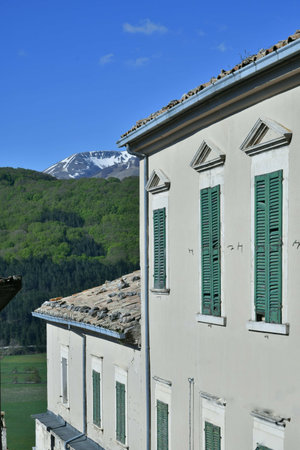 Windows with a panoramic view of the Abruzzo mountains in the village of Rivisondoli.