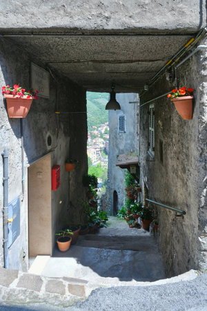 A narrow street among the old houses of Subiaco, a medieval town near Rome.の写真素材