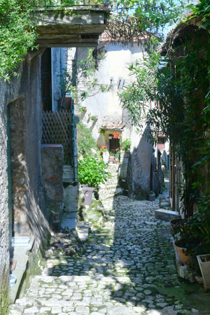 A narrow street among the old houses of Artena, a medieval town near Rome.の写真素材