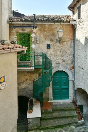 A narrow street among the old houses of Cervara di Roma, a medieval town in the Lazio region.の写真素材