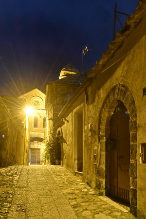 A narrow street at night in Casertavecchia, a medieval village in the Campania region.の写真素材