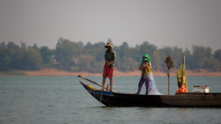 Mekong River, Vietnam - March 16, 2016: people fishing on the Mekong river on traditional boatsのeditorial素材