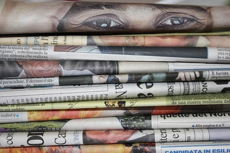 pile of newspapers with eyes that lookの写真素材