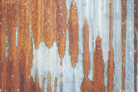 close up of old rusty zinc plat wall texture background.の写真素材