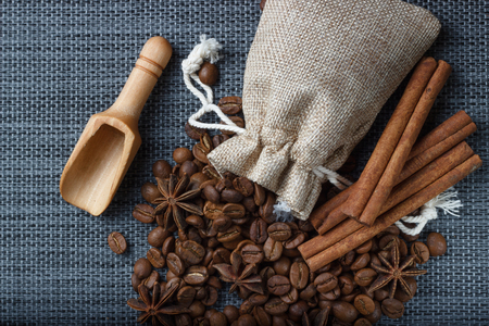 Bag of coffee beans with anise on sackclothの写真素材