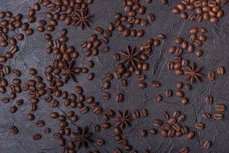 Scattered grain coffee on a dark concreteの写真素材