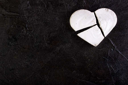 Protein is a broken heart against a concrete background.の写真素材