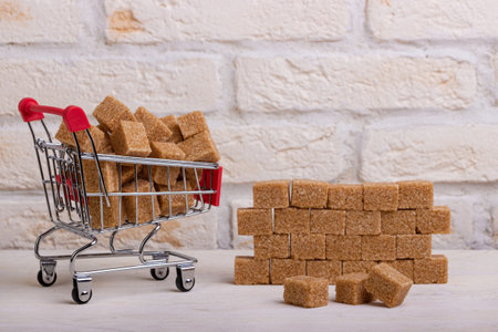Cane sugar cubes are unloaded from the cartの写真素材