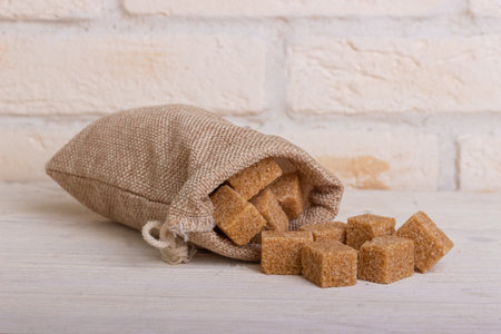 Brown sugar cubes in a bagの写真素材