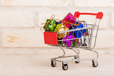 Gift boxes in a shopping trolleyの写真素材
