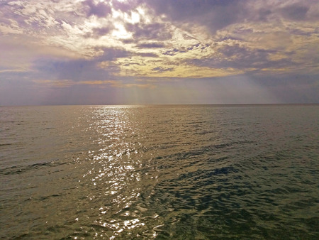 The rays of the sun over the Greek Mediterranean Seaの写真素材