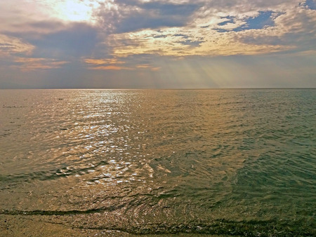 The rays of the sun over the Greek Mediterranean Seaの写真素材