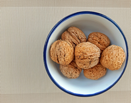 A  plate of nuts on canvas backgroundの写真素材