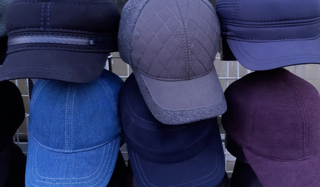Different kinds of hats on sale close up