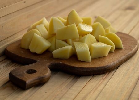 Sliced potatoes. Cooking process concept. Natural and fresh potatoesの写真素材