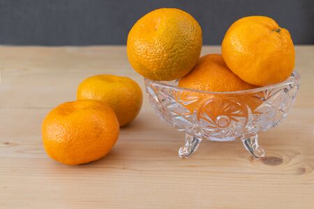 Clementines on wooden background. Clementine benefits for health concept. Holiday Conceptの写真素材