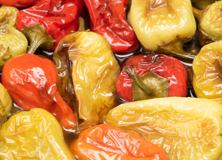 Fried and tasty peppers close up. White and red pepersの写真素材