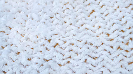 The texture of a white coat close up background.の写真素材