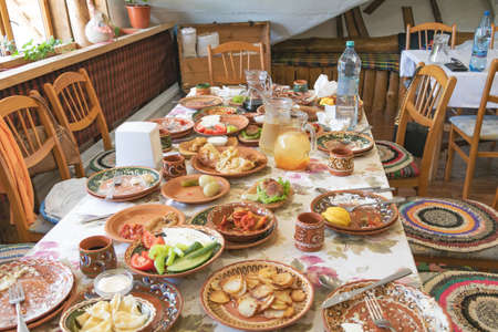 Orheiul vechi, Moldova - June 14, 2021 Tasty food on the table in a restaurant.のeditorial素材